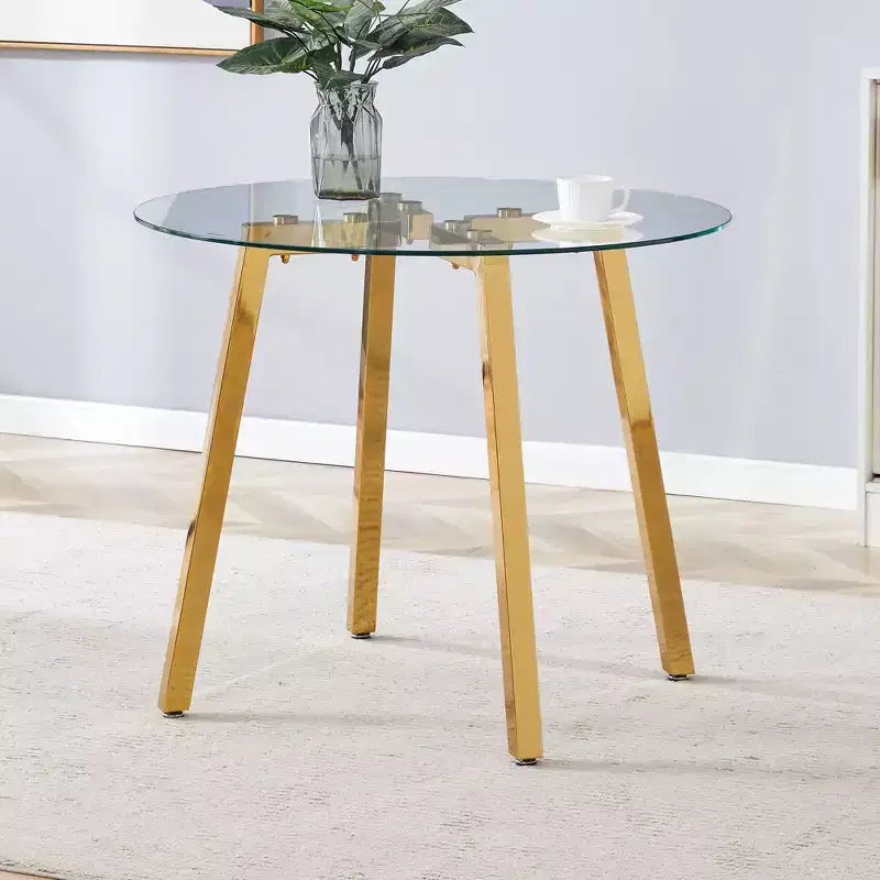Tavolo da pranzo rotondo moderno di lusso con piano in vetro e gambe in metallo per sala da pranzo