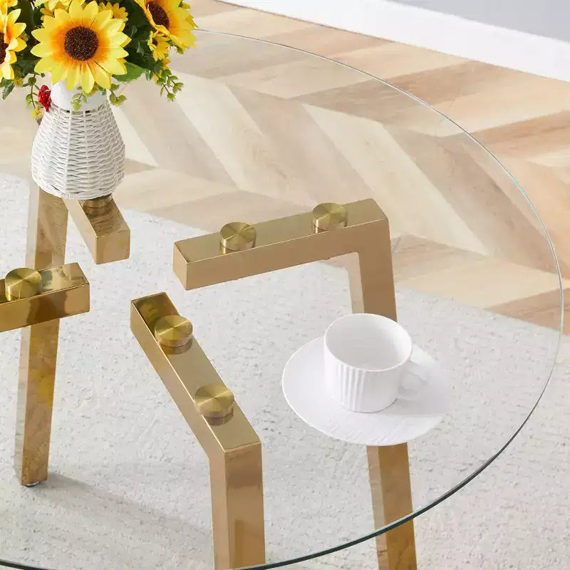 Tavolo da pranzo rotondo moderno di lusso con piano in vetro e gambe in metallo per sala da pranzo